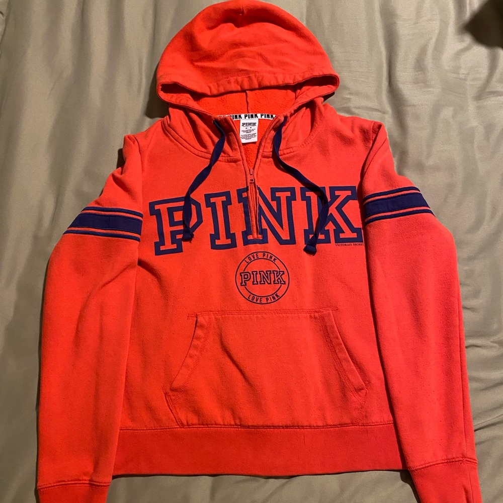 Pink hooded half zip. Size Medium. Orange and blue.